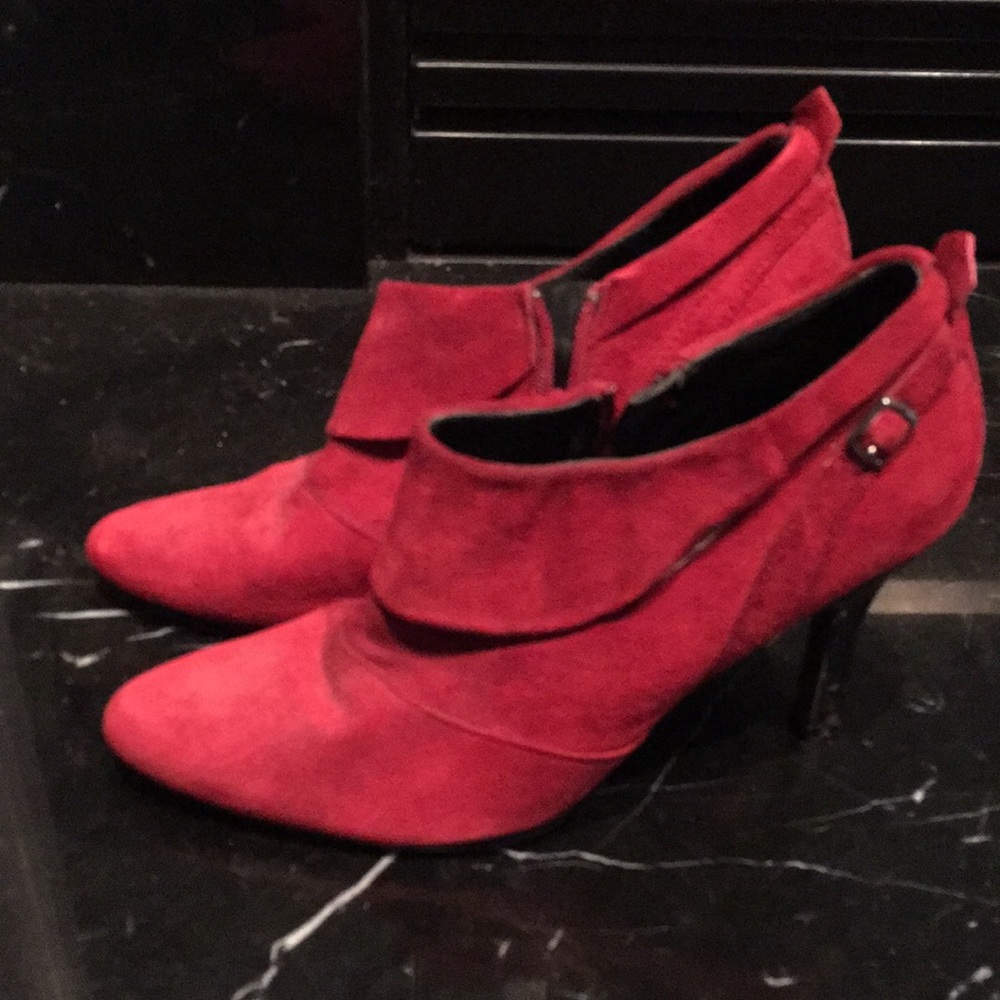 Women's red high heeled boots.